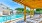 resort style swimming pool with poolside pergola