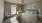 a bedroom with a bed and a fan