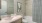 a bathroom with a pink tub and a white toilet