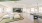 a large room with white couches